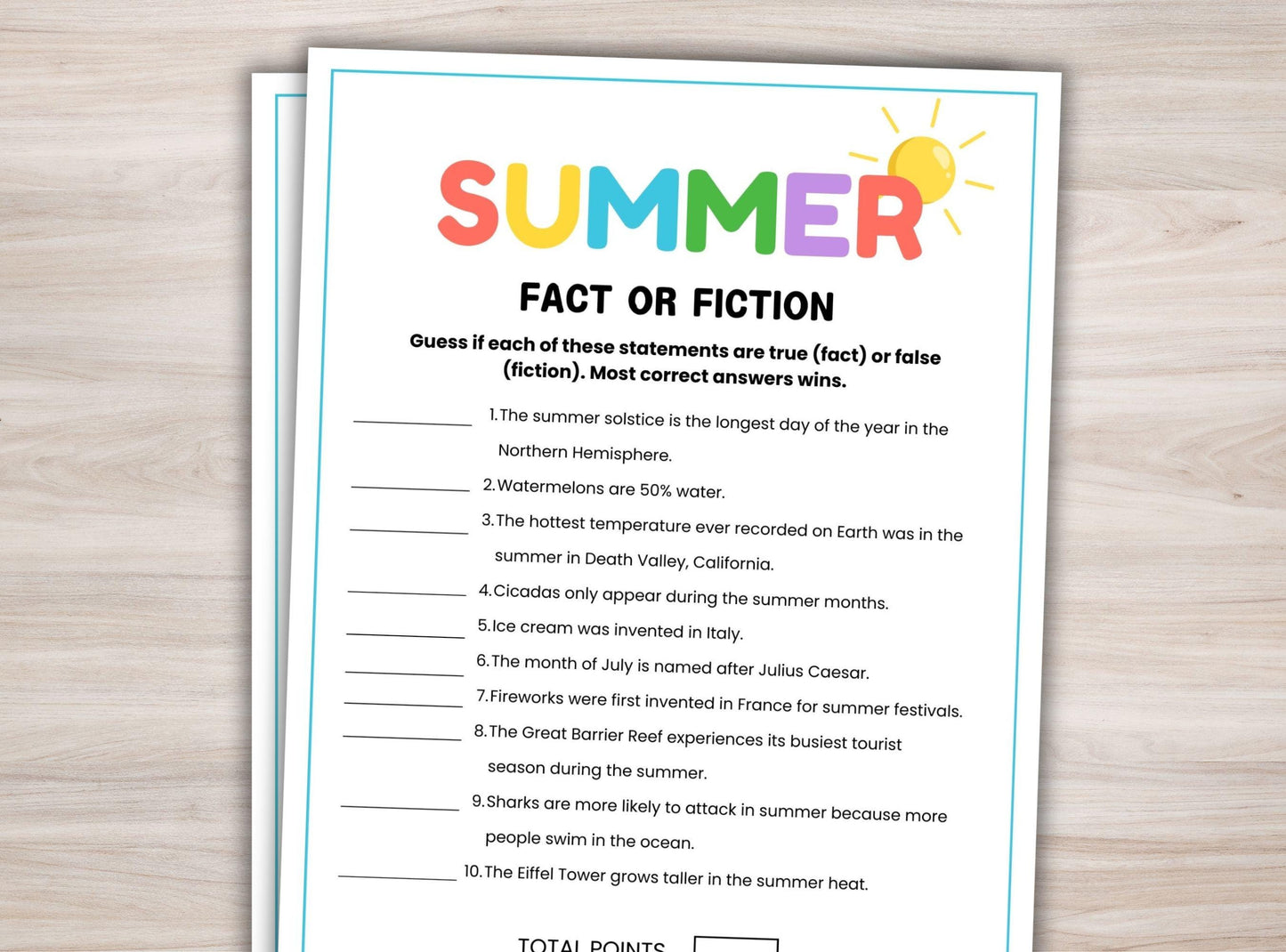Summer fact or fiction worksheet on a wooden surface