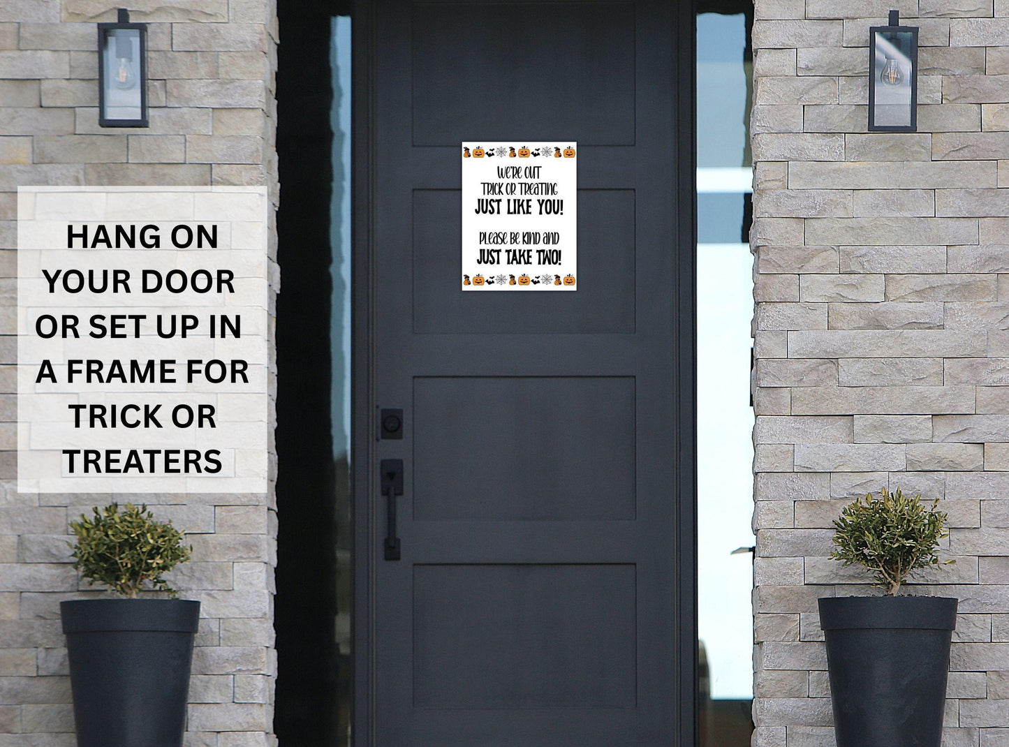 Decorative sign on a door with text for Halloween, placed against a stone wall.