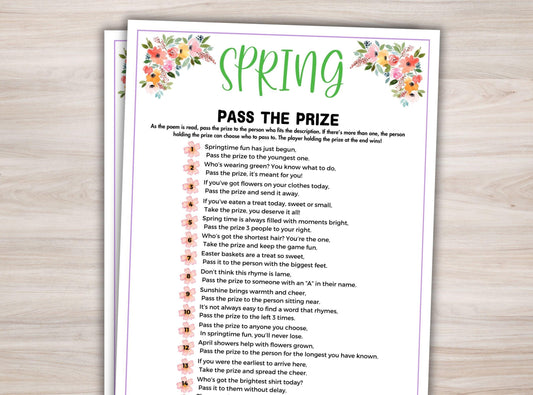 Sheet of paper with 'Pass the Prize' game instructions on a wooden surface