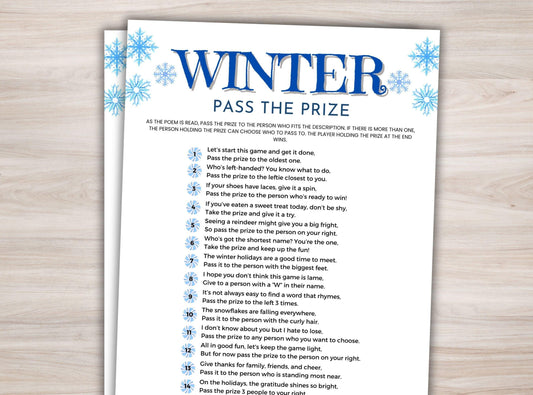 Sheet of paper with 'Winter Pass the Prize' game instructions on a wooden surface