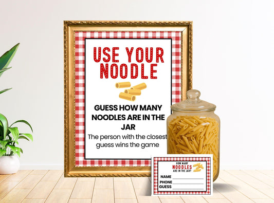 Framed print with 'Use Your Noodle' text and a jar of noodles on a table.