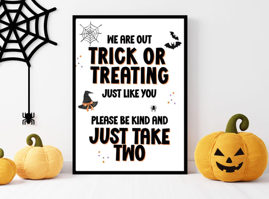 Halloween-themed sign with pumpkins and spider web decorations on a white background